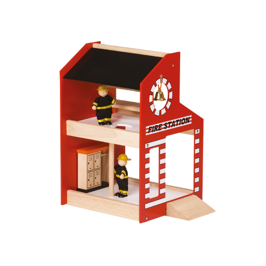 A two-level fire station building toy with a ramp, featuring a red body with a white and orange trim, and a small doll with a fire helmet inside.