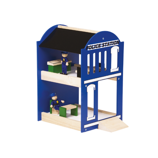 A wooden toy police station playset with a blue and white building, featuring a ramp and two miniature figures inside.
