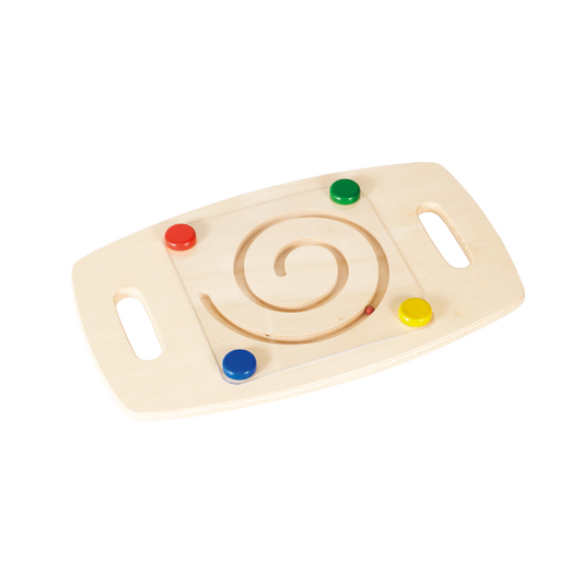 A spiral-shaped balance board for toddlers with colorful marbles at the starting points and a groove in the center.