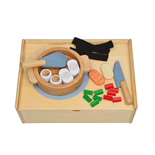 Wooden Japanese cooking set for children, including a stove, pot, pan, spoon, and various colorful food pieces.