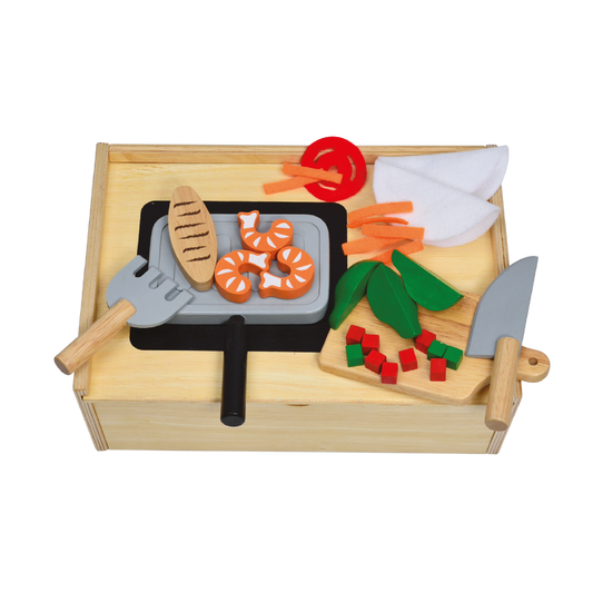 Children's toy kitchen set featuring a wooden cutting board, knives, and various pretend food items.