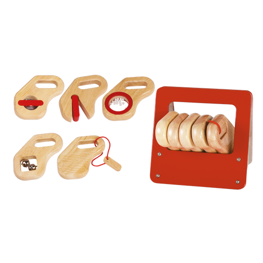 A collection of wooden percussion instruments including a maraca, slap stick, cymbal, rasp, and jingle bell, with a red storage box.
