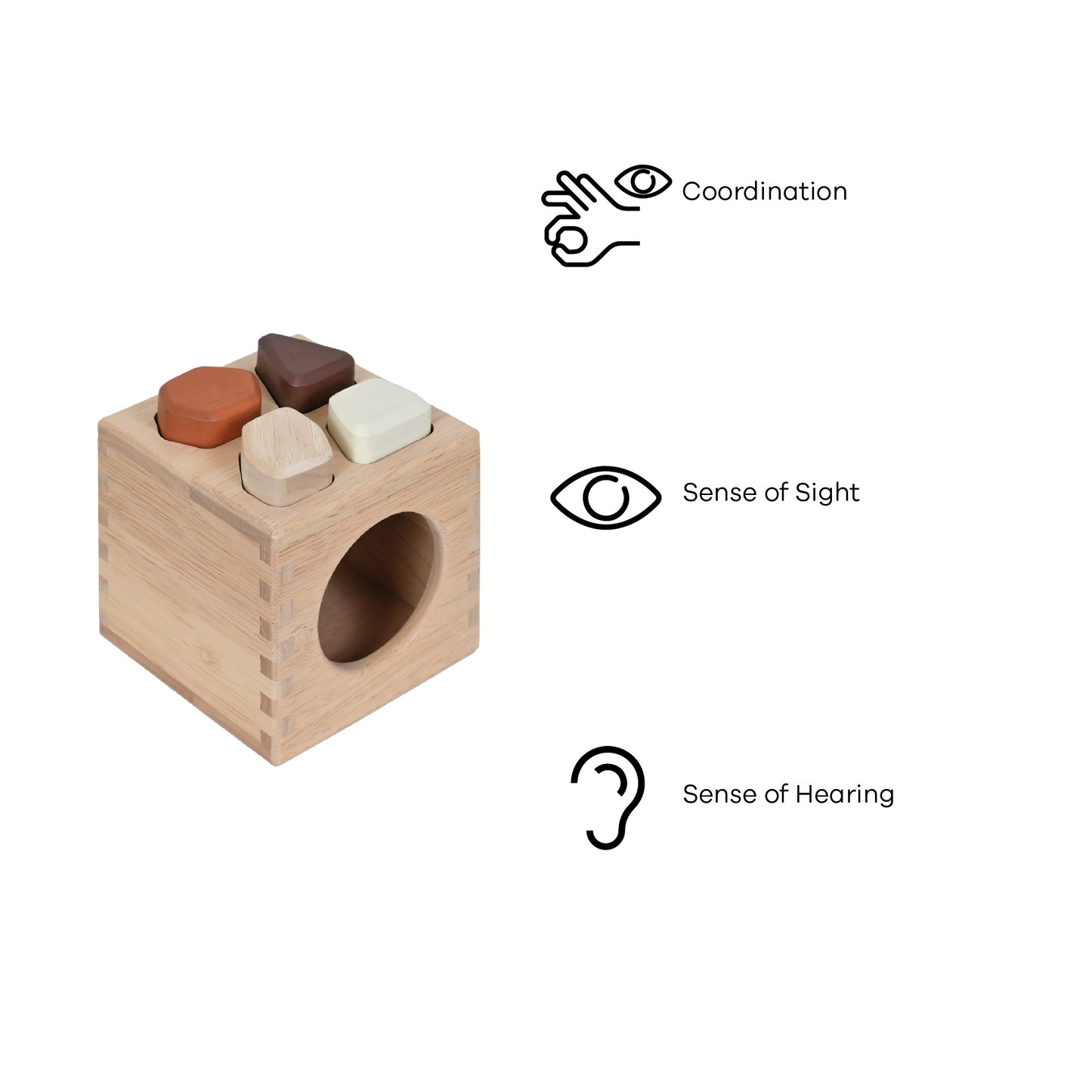 A wooden sound stones sorter box with four colorful irregular shaped pieces inside.